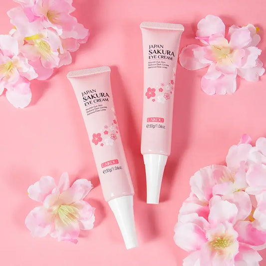 LAIKOU Japan Sakura Eye Cream tubes with sakura flowers for moisturizing, anti-puffiness, and dark circle reduction, 30g.